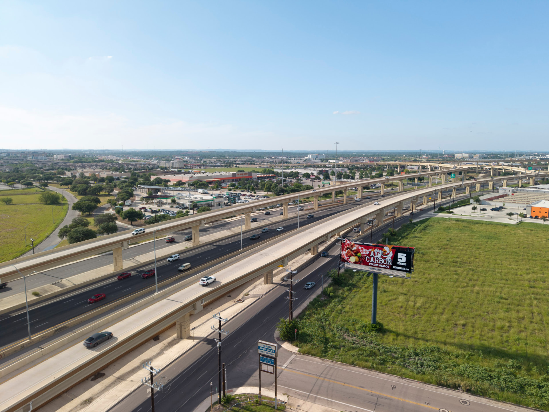Aerial context photo of a billboard location along a major highway corridor