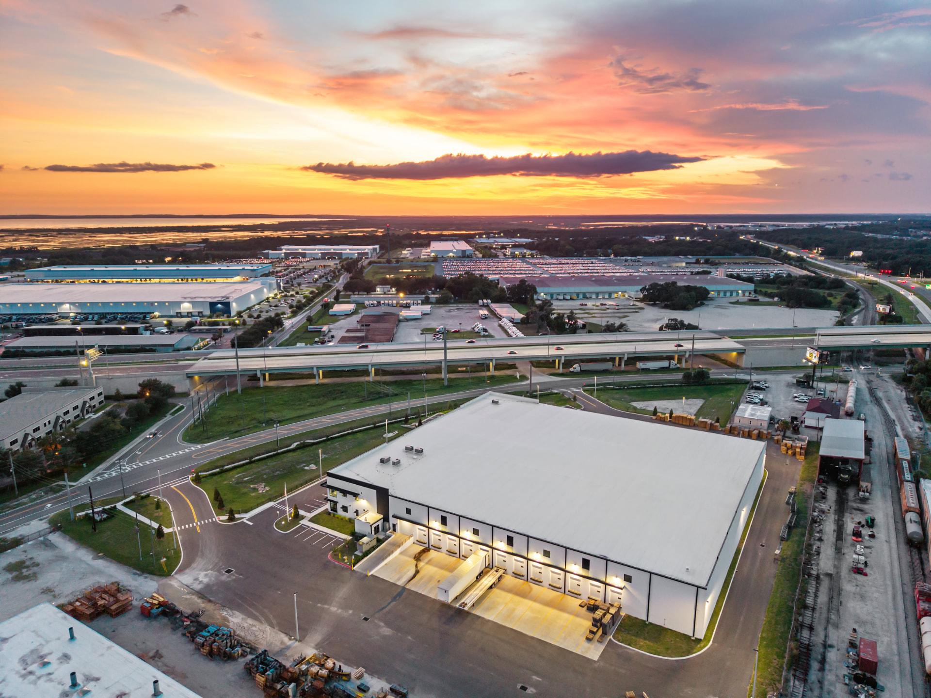 Hallowell facility facade at dusk with illuminated signage, aerial photography by IRL Marketing