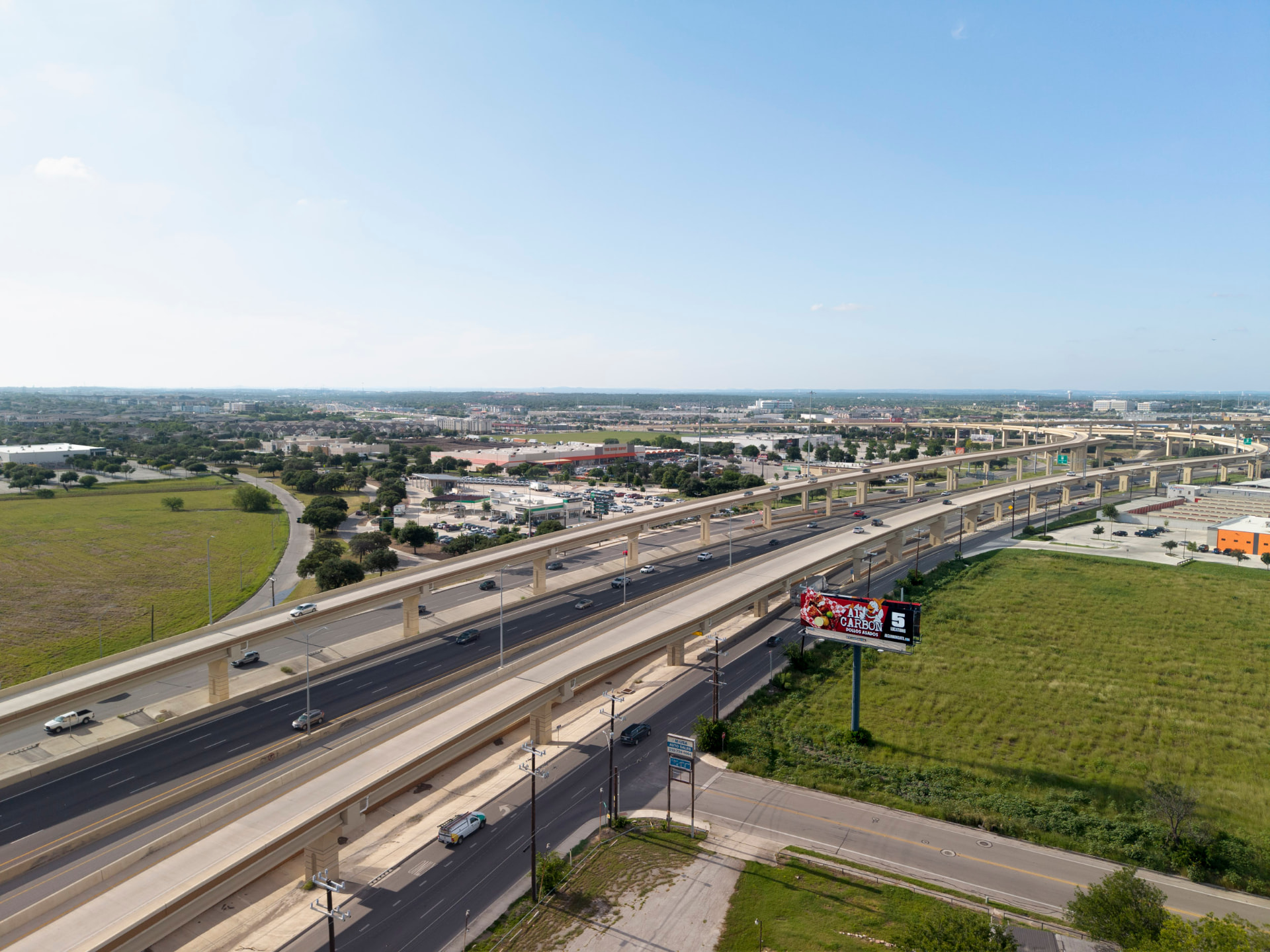 Aerial context photo of a billboard location along a major highway corridor
